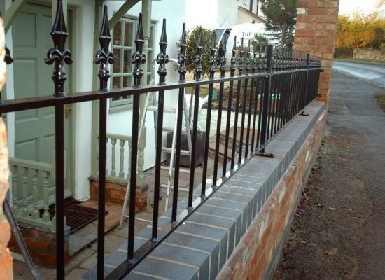 Wall top iron railings